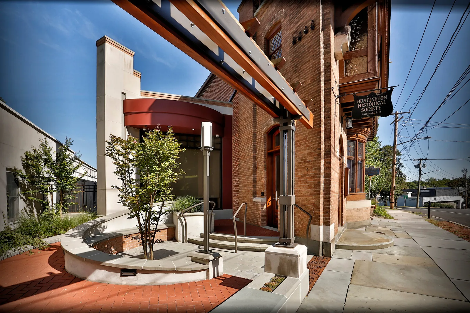 Commercial architectural photograph of the Huntington Historical Society building on a clear day