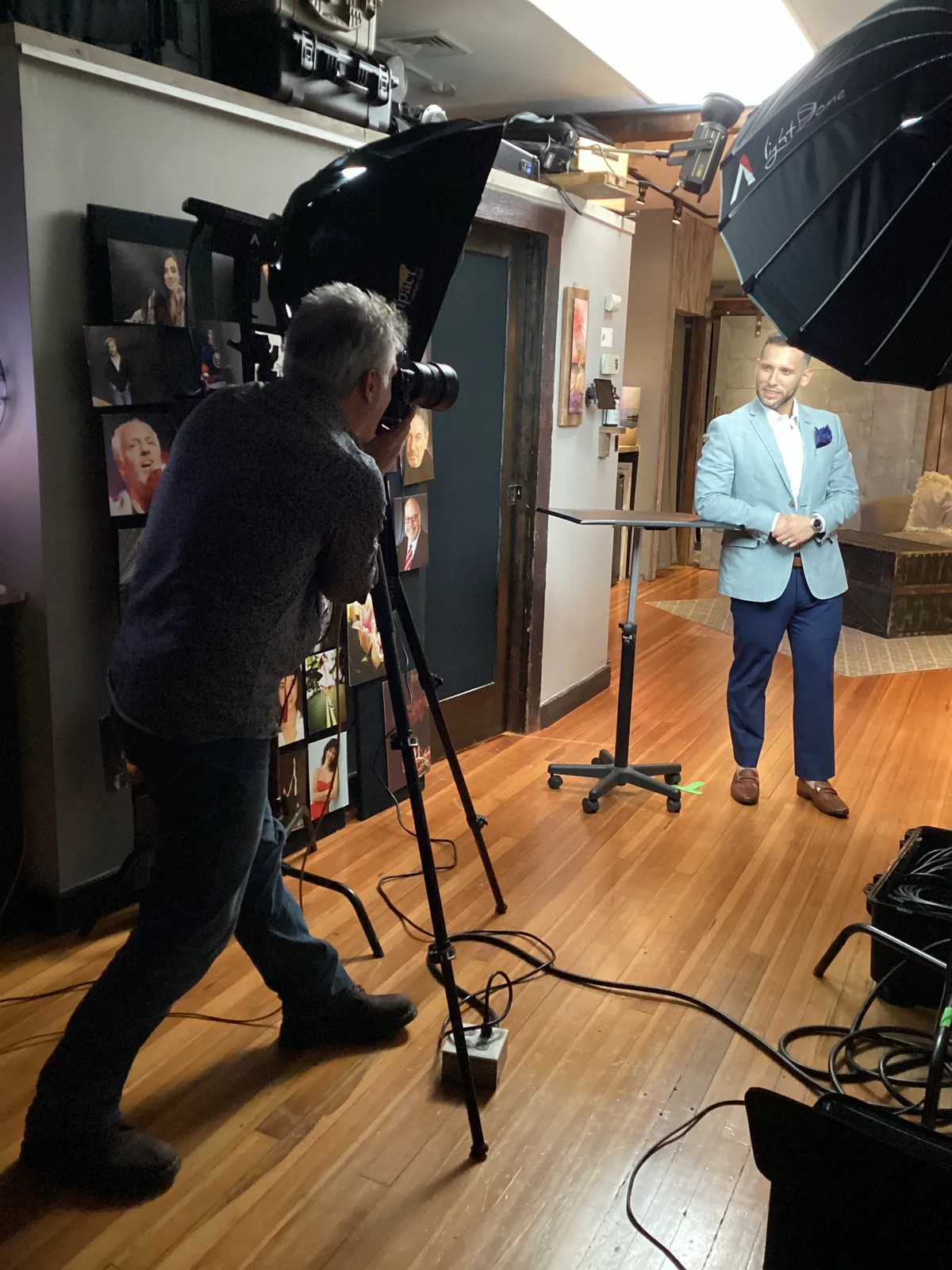 Len Marks photographing a client in the Huntington studio during a same-day headshot session