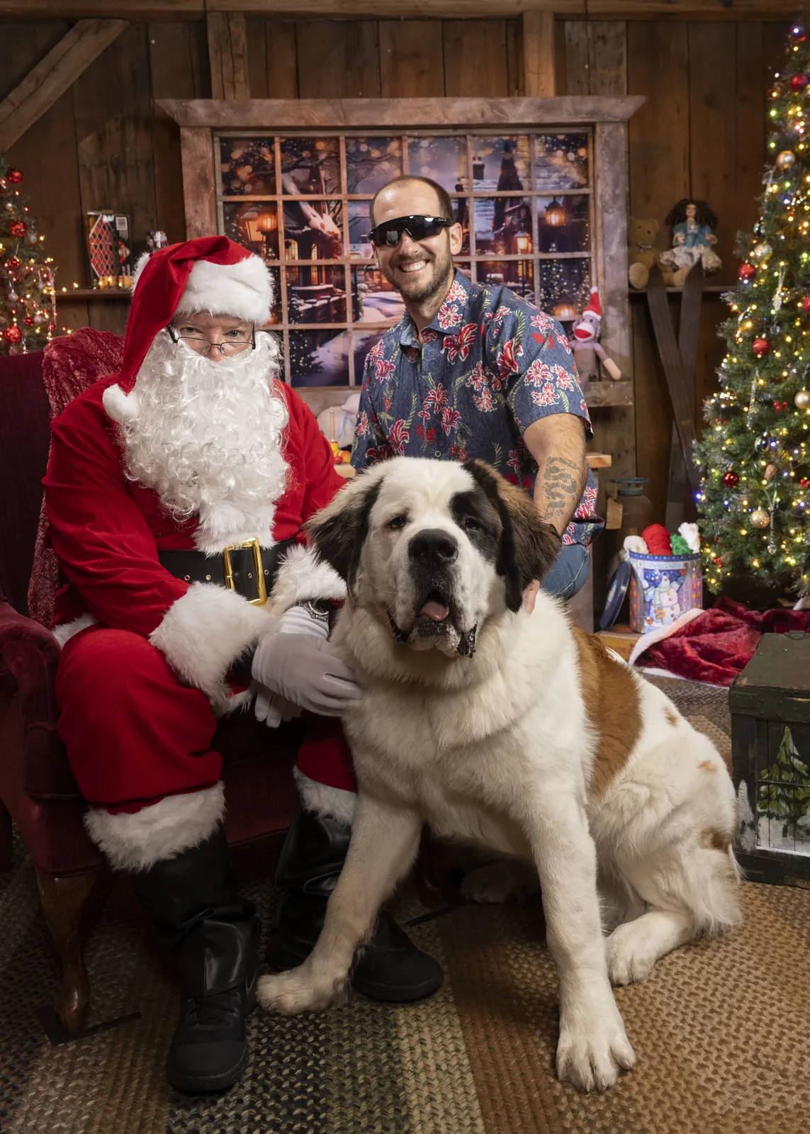 A man and his Saint Bernard with Santa