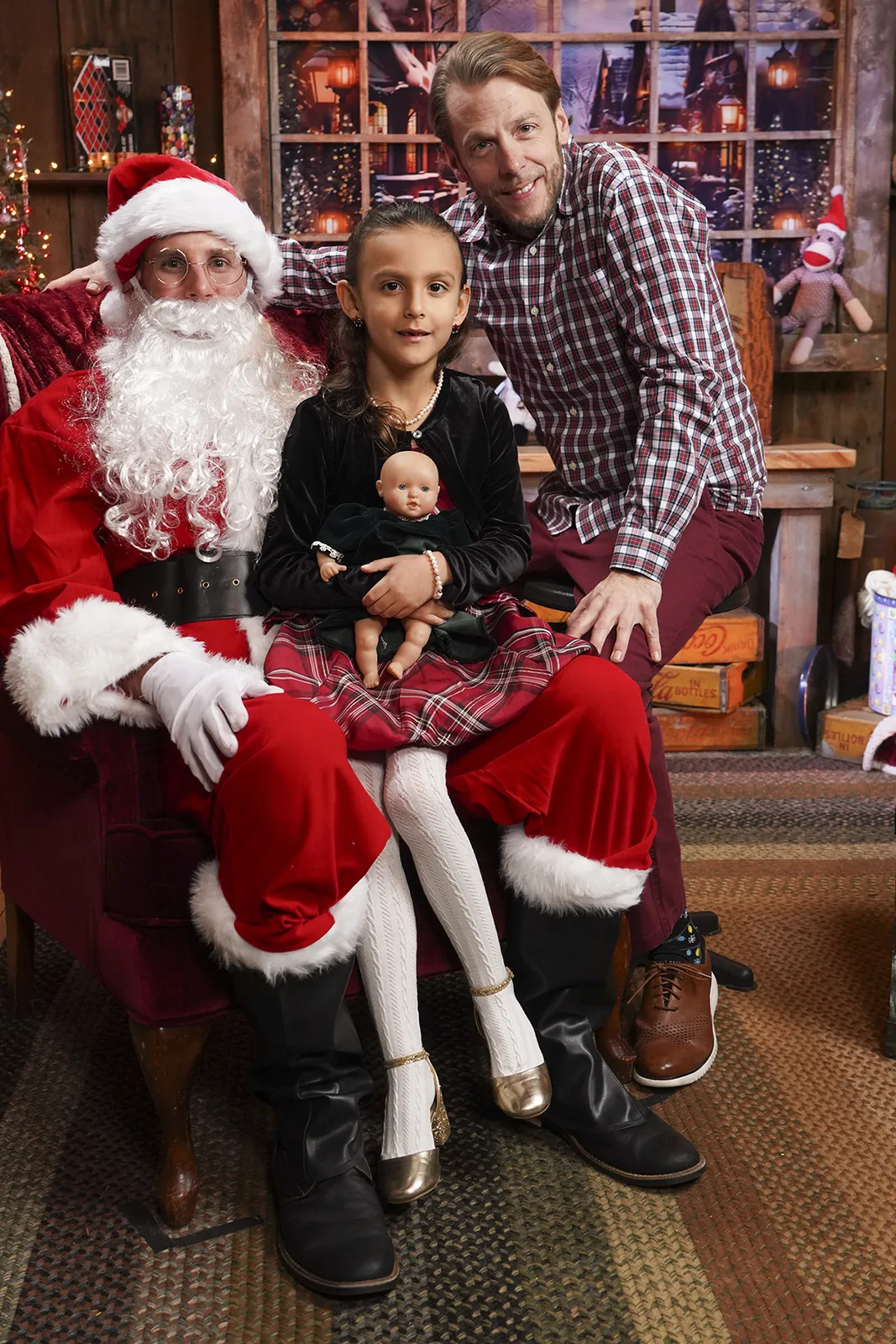 A little girl with Santa at the Conklin Barn